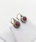 Boucles d'oreilles Dormeuses marguerite anciennes en or rose 18k, rubis synthétiques et diamants 58 Facettes A06761