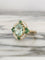Bague 55 Bague en or jaune 18K avec tourmaline verte, diamants et tsavorites 58 Facettes 241
