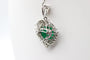 Pendentif Pendentif cœur en or blanc avec émeraude et diamants 58 Facettes 240165