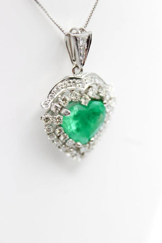 Pendentif Pendentif cœur en or blanc avec émeraude et diamants 58 Facettes 240165