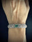 Bracelet Bracelet Art déco en platine et or blanc, émeraude et diamants 58 Facettes Bracelet 11