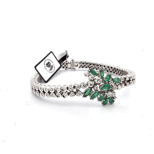Bracelet Bracelet vintage en or blanc 18 ct avec émeraudes et diamants 58 Facettes 383/A OC