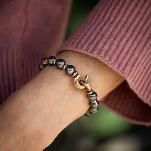 Bracelet Cartier - Bracelet perlé en or jaune et hématite 58 Facettes 50222