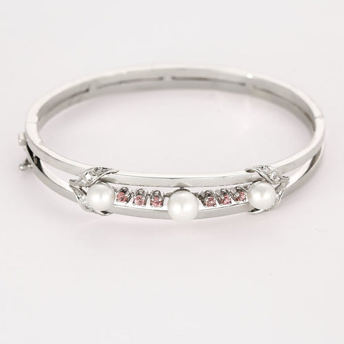 Bracelet Bracelet jonc en or gris ajouré de perles de cultures et diamants 58 Facettes LF6