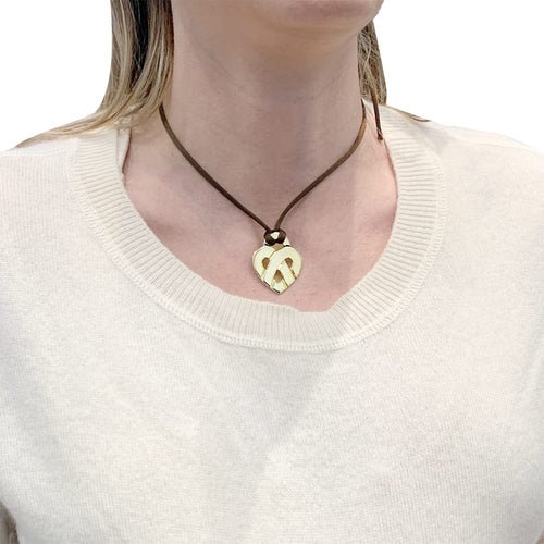 Pendentif Pendentif Poiray, "Coeur Entrelacé", or jaune. 58 Facettes 35395