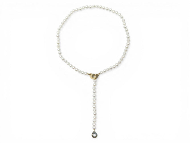 Collier Dinh Van - Collier menottes en or jaune 18k et perles d'eau douce 58 Facettes 273895