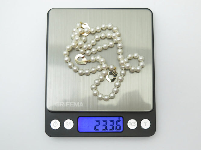 Collier Dinh Van - Collier menottes en or jaune 18k et perles d'eau douce 58 Facettes 273895