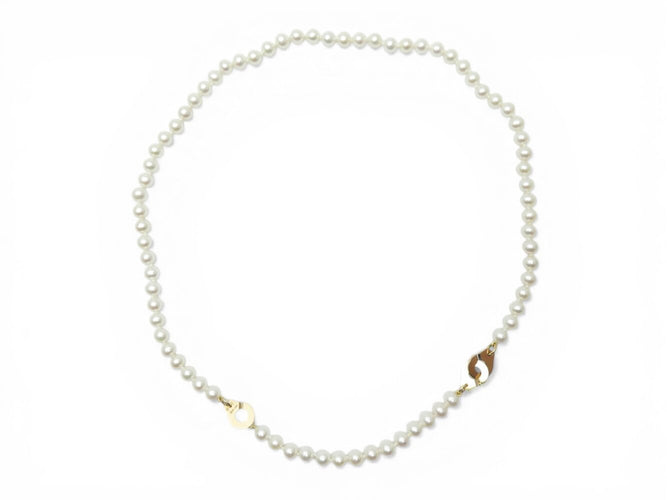 Collier Dinh Van - Collier menottes en or jaune 18k et perles d'eau douce 58 Facettes 273895