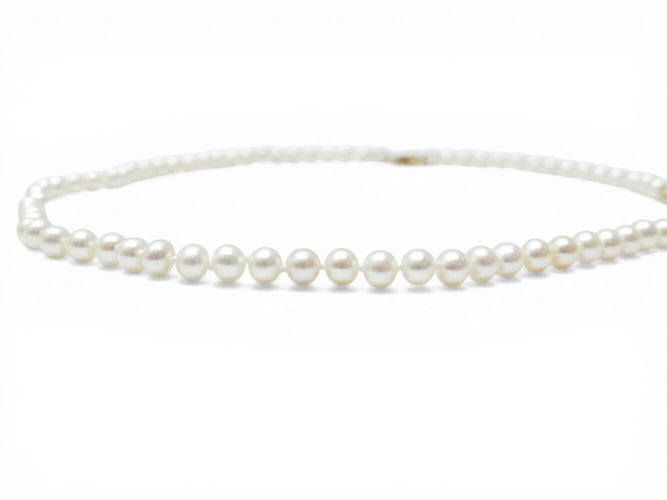 Collier Dinh Van - Collier menottes en or jaune 18k et perles d'eau douce 58 Facettes 273895