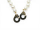 Collier Dinh Van - Collier menottes en or jaune 18k et perles d'eau douce 58 Facettes 273895