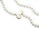 Collier Dinh Van - Collier menottes en or jaune 18k et perles d'eau douce 58 Facettes 273895