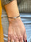 Bracelet Dinh Van Menottes - Bracelet sur cordon XS en or blanc et diamants 58 Facettes Dv