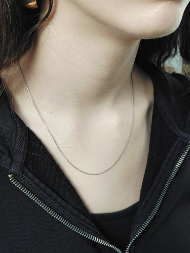 Collier Chaîne en maille forçat en platine 58 Facettes 1735012