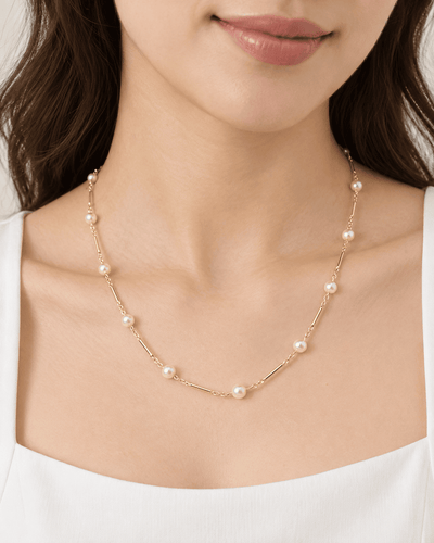 Collier Collier en or jaune à perles – boules alternées par des barres 58 Facettes 33659