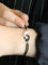 Bracelet DINH VAN Bracelet Menottes R12 or blanc cordon noir 58 Facettes 1215.8