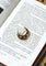 Broche Broche croissant de lune ancienne en or rose 18 ct, diamants et émeraudes 58 Facettes