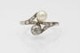 Bague 52 Bague Toi et Moi Art nouveau en or blanc 14 ct, perle et diamants 58 Facettes 11992