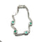 Bracelet Bracelet en or blanc 18 carats avec diamants et émeraudes colombiennes 58 Facettes 50399