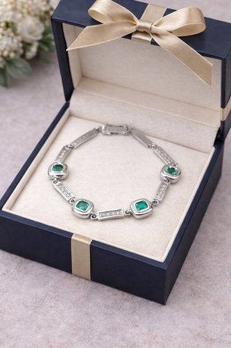 Bracelet Bracelet en or blanc 18 carats avec diamants et émeraudes colombiennes 58 Facettes 50399