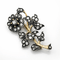 Broche Broche florale espagnole en argent et or aux diamants taille rose 58 Facettes 50289