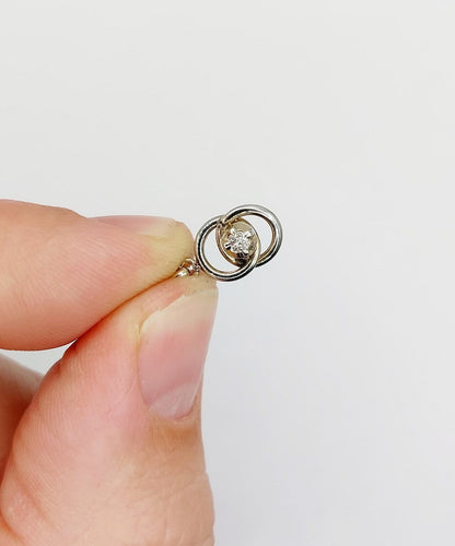 Pendentif Pendentif antique nœud infini en or blanc 18k et diamant (circa 1920) 58 Facettes A06948