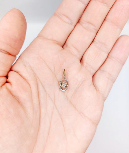 Pendentif Pendentif antique nœud infini en or blanc 18k et diamant (circa 1920) 58 Facettes A06948