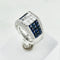 Bague cocktail en or blanc 750 avec saphirs et diamants taille princesse 58 Facettes 1710