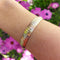 Bracelet Bracelet ruban articulé trois ors 14k ciselé 58 Facettes 251