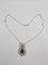 Pendentif Pendentif nœud Belle Époque, saphir briolette et diamants 58 Facettes Collier O2366