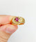 Bague rétro en or 18k avec rubis synthétique et diamants 58 Facettes A01910