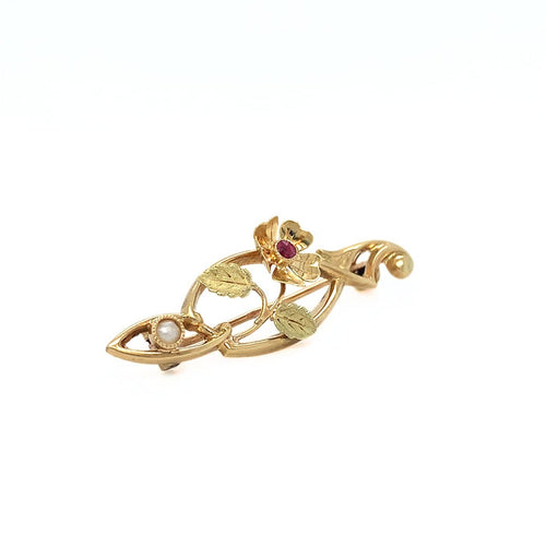 Broche Broche Art nouveau en or jaune 750 avec rubis et perle 58 Facettes 434771
