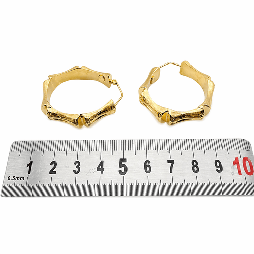 Boucles d'oreilles Boucles d’oreilles créoles maille bambou en or jaune 18 carats 58 Facettes Boucles d'oreilles créoles bambous en or