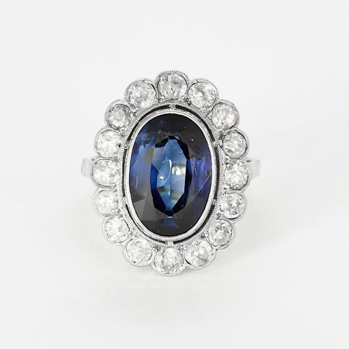 Bague 50 Elegante Bague marguerite en platine et or gris, saphir de synthèse et diamants 58 Facettes 260264