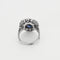 Bague 50 Elegante Bague marguerite en platine et or gris, saphir de synthèse et diamants 58 Facettes 260264