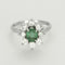 Bague 55 Bague Marguerite en or gris, émeraude et diamants 58 Facettes 260212