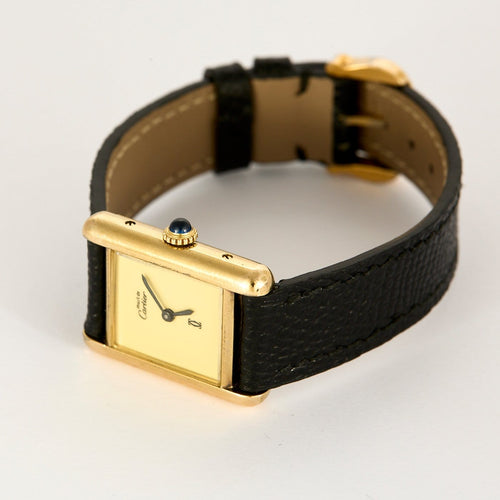 Montre Cartier Tank Must - Montre en argent plaqué or, cadran crème 58 Facettes A1179