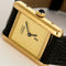 Montre Cartier Tank Must - Montre en argent plaqué or, cadran crème 58 Facettes A1179