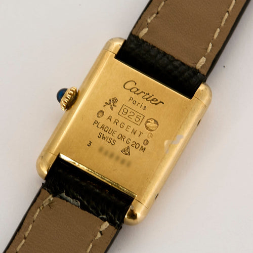 Montre Cartier Tank Must - Montre en argent plaqué or, cadran crème 58 Facettes A1179