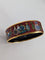 Bracelet Hermès - Jonc « Qu'importe le Flacon » en plaqué or et émail 58 Facettes 608