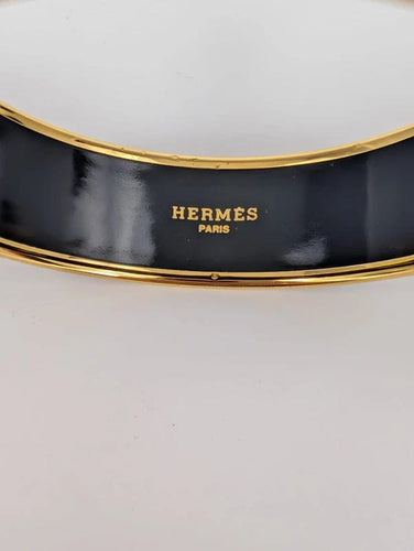 Bracelet Hermès - Jonc « Qu'importe le Flacon » en plaqué or et émail 58 Facettes 608