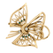 Broche Broche nœud stylisé en or jaune 18 carats, diamants et émeraudes 58 Facettes 36314