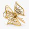 Broche Broche nœud en or jaune, diamants et émeraudes 58 Facettes 36314