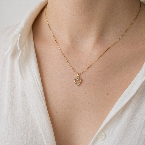 https://18carats.fr/wp-content/uploads/2026/04/36369-36515-Pendentif-coeur-ajoure-en-or-jaune-et-diamants.png