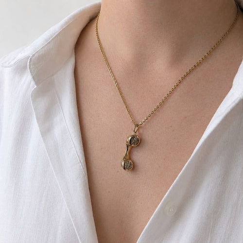 Pendentif Pendentif combiné téléphonique en or jaune et diamants 58 Facettes 36393