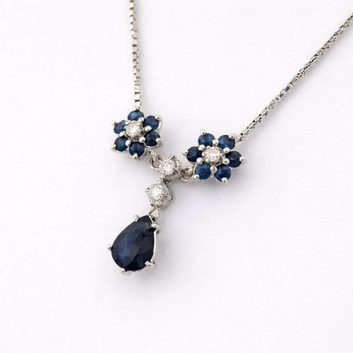 Collier Collier pendentif marguerite en or blanc, saphirs et diamants 58 Facettes 36249