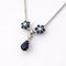 Collier Collier pendentif marguerite en or blanc, saphirs et diamants 58 Facettes 36249