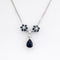 Collier Collier pendentif marguerite en or blanc, saphirs et diamants 58 Facettes 36249