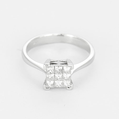 Bague 51 Bague moderniste en or gris et petits diamants princesse 58 Facettes 260274