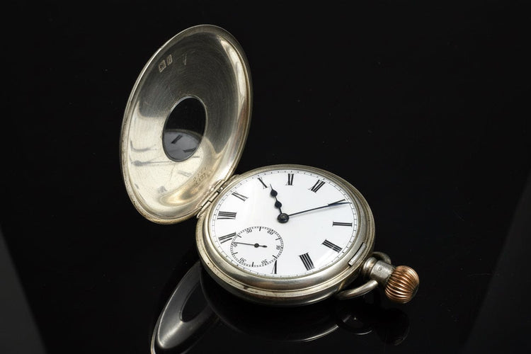 Montre Montre de poche anglaise œil-de-bœuf en argent 58 Facettes