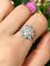 Bague 54 Bague marguerite en platine et diamants 58 Facettes 262